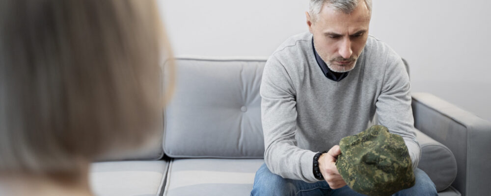 person-suffering-from-ptsd-psychologist-1-scaled